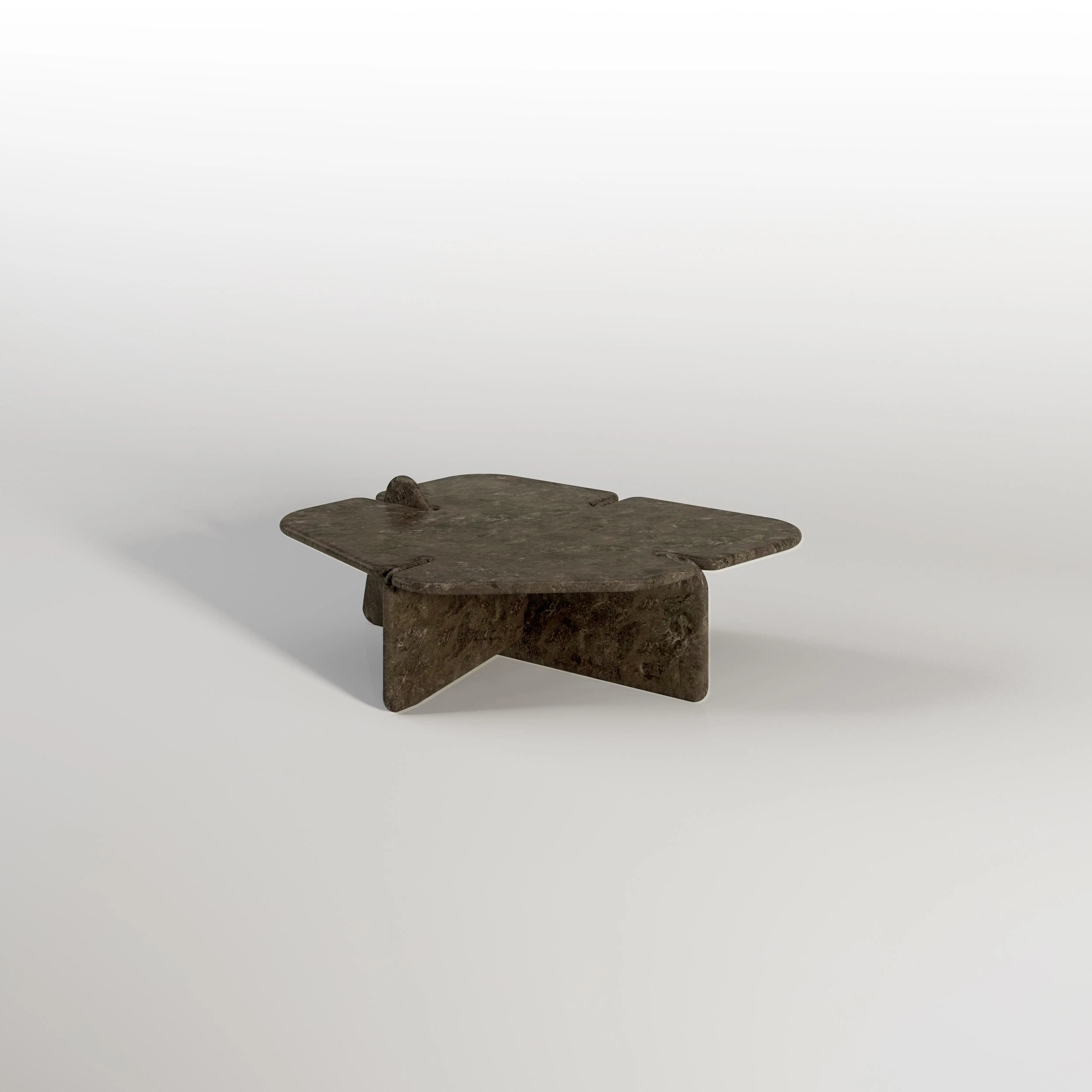 A modern coffee table features a unique, four-pointed star shape and a dark, textured tabletop.